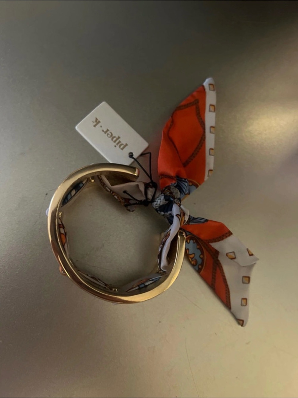 Piper.K Gold Bangle Bracelet with Orange and White Scarf Accent